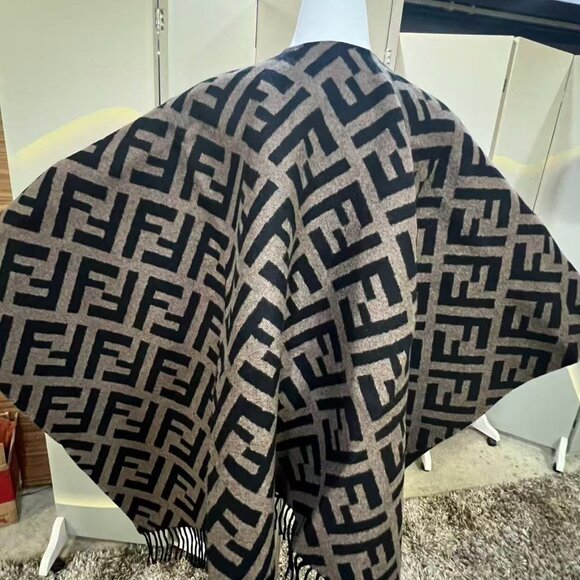 This is a Fendi shawl featuring the brand's iconic FF pattern. - Picture 4 of 8